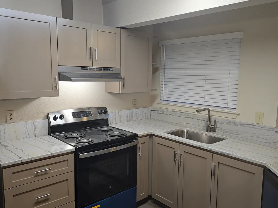 Newly remodeled kitchen with all new cabinets, countertops, appliances and fixtures