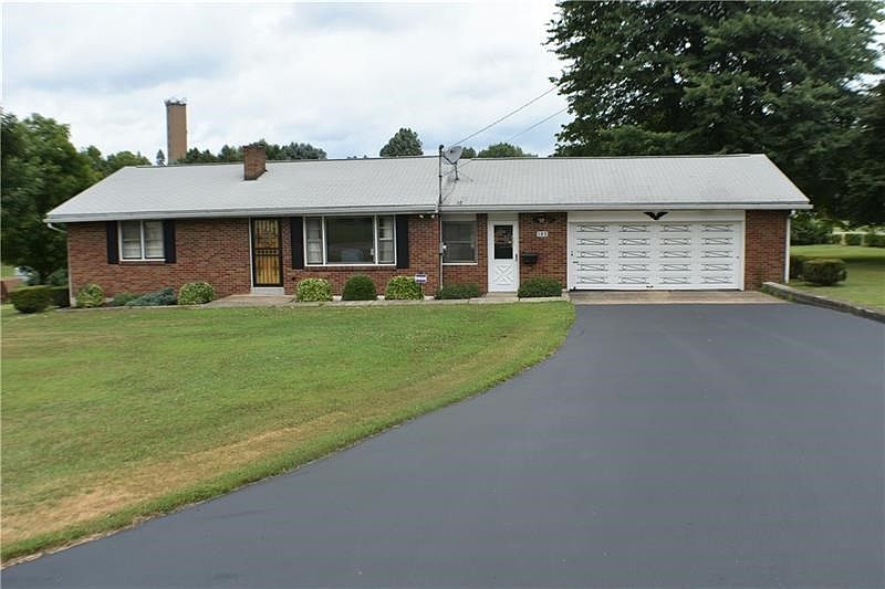 Welcome to 105 Reed Drive - This freshly sealed blacktop and 1.2 acre corner lot, is waiting for you to come home.