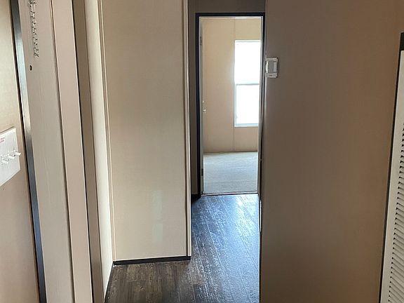 Hallway to bedroom #2 and #3. Awesome split plan