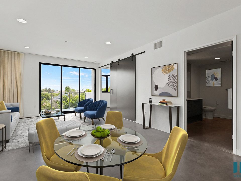 Open-Concept Kitchen, Dining, and Living Room Space with Bedroom and Bathroom