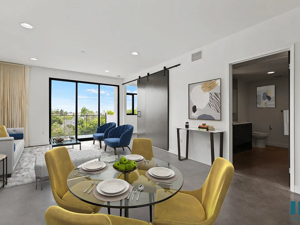 Open-Concept Kitchen, Dining, and Living Room Space with Bedroom and Bathroom