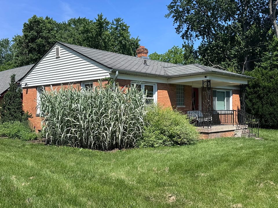 Beautiful brick home with mature trees and great landscaping.