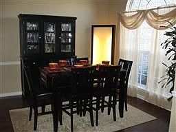Bright Formal Dining Room with Trey Ceiling and Fabulous Window