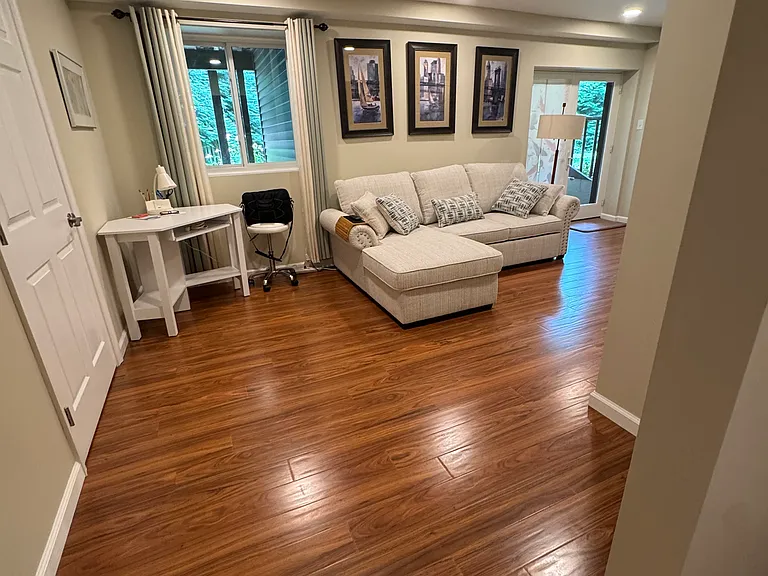 View of desk & window/ bedroom on the left. Dining & kitchen area behind,