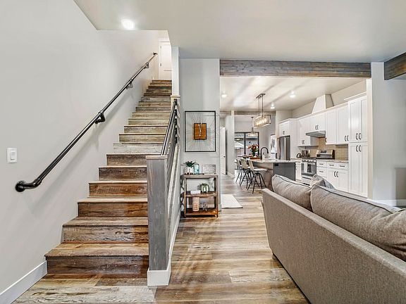 Living Room With Stairway to Bedrooms Upstairs