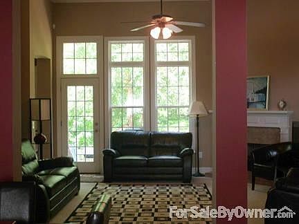 Living Room
						:
						High ceilings, tall windows, and a gas fireplace truly make this a great room