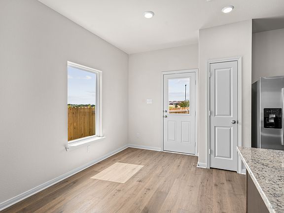 The dining room sits right off of the kitchen.