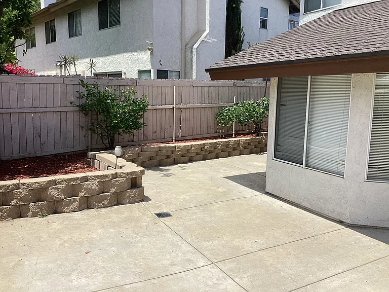 Backyard with view of retaining wall
