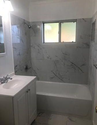 Just completed all new bathroom with a new tub, tile shower area new sink, new mirror medicine cabnet, new sink and cabinet and new light fixture and new tile floor.