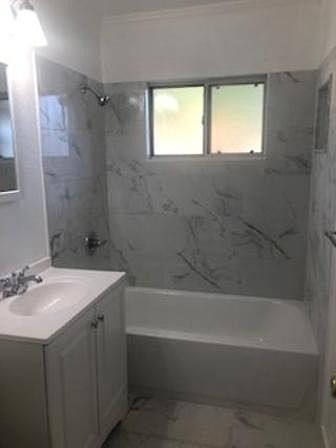 Just completed all new bathroom with a new tub, tile shower area new sink, new mirror medicine cabnet, new sink and cabinet and new light fixture and new tile floor.