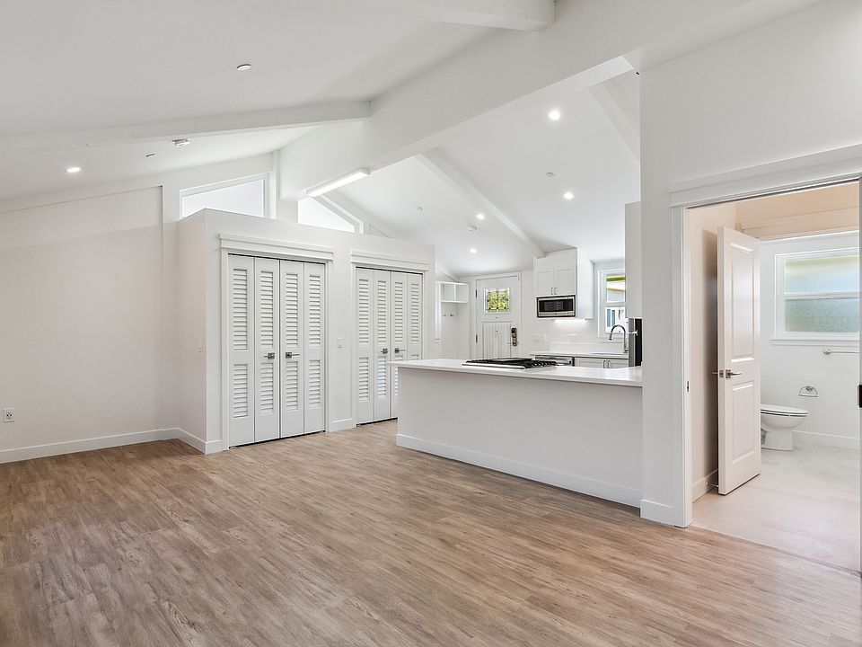 Main living space and Kitchen, with vaulted ceilings