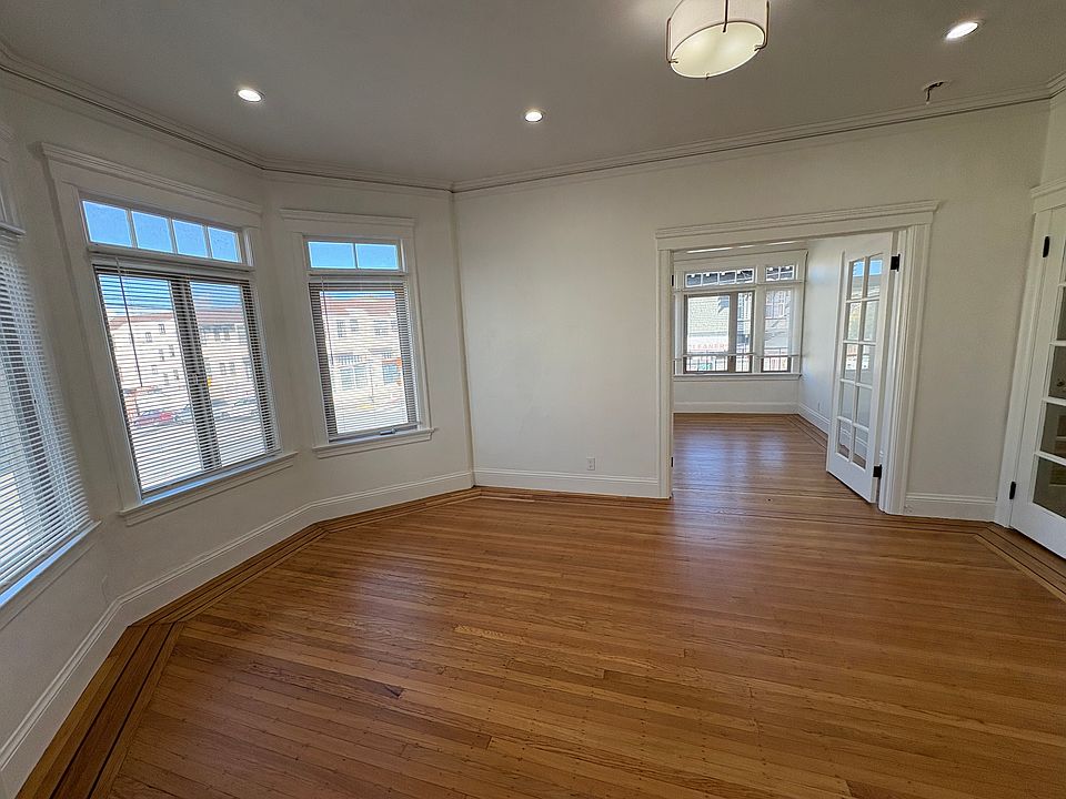 Amazing Living room with Bay windows & one of 2 bedrooms adjacent with French Doors