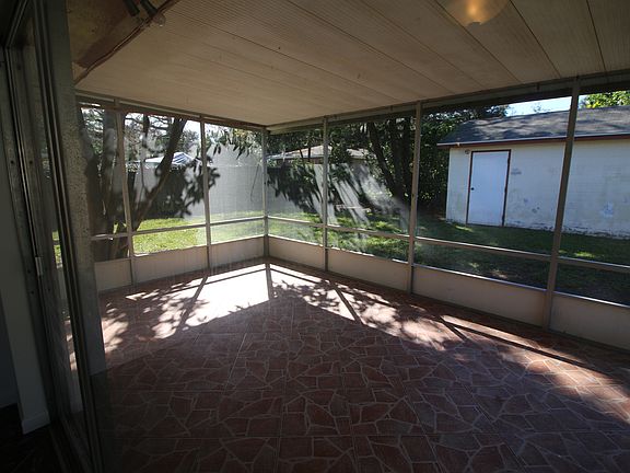 Screened in & tiled sunroom