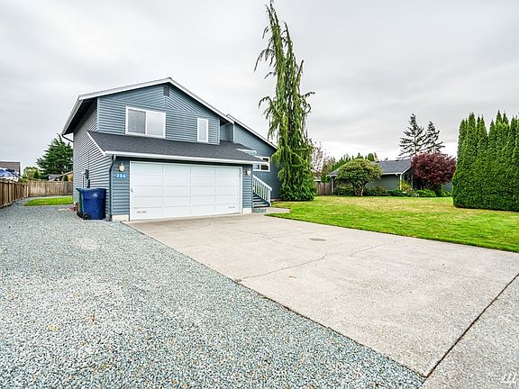 Look at all that parking! Room for RV along side of home and easy access to back yard.