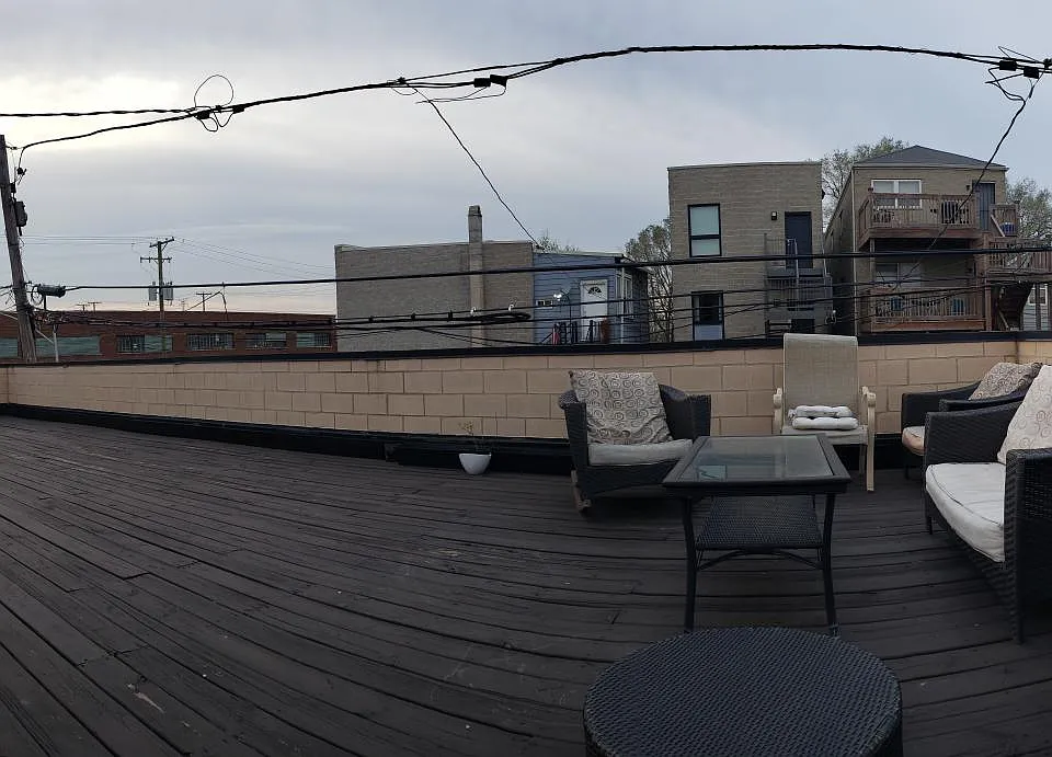 Backyard UPPER deck. There is also a lower deck.