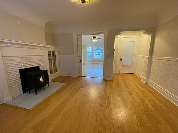 living room with pocket doorway to second bedroom