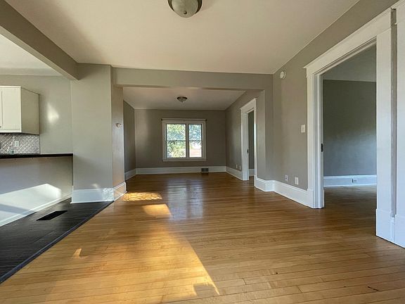 View from large open concept family room, Original refinished hardwood floors