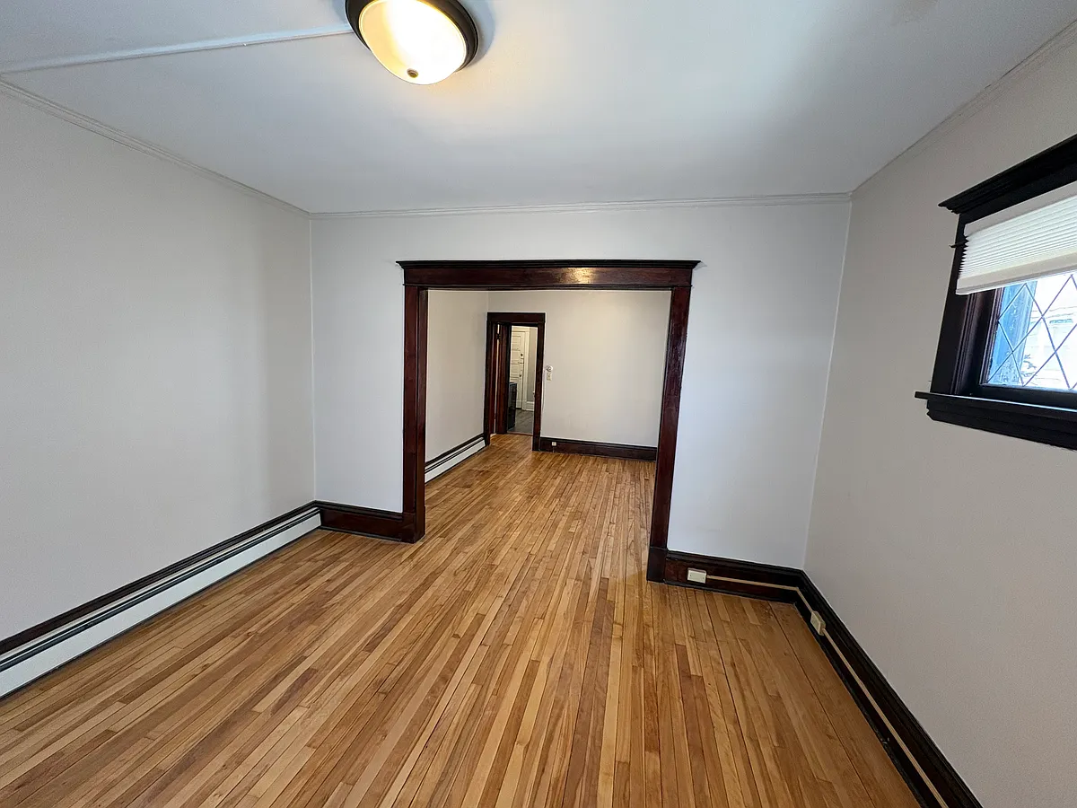 living room looking into dining room - 3208 Garfield Ave #3