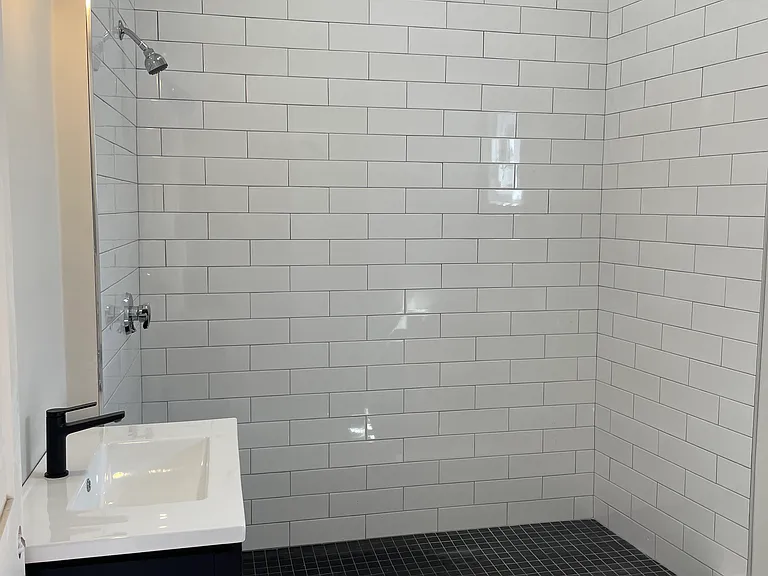 Large second bath; glass enclosed shower