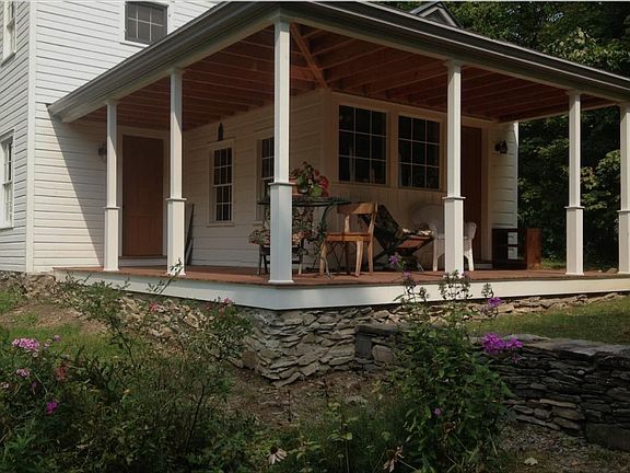 Back porch facing mill pond and garden