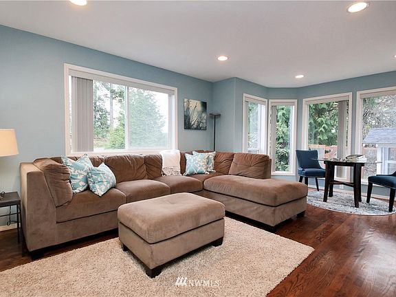 Off of the kitchen area you will find a spacious family room with walnut-stained oak flooring.