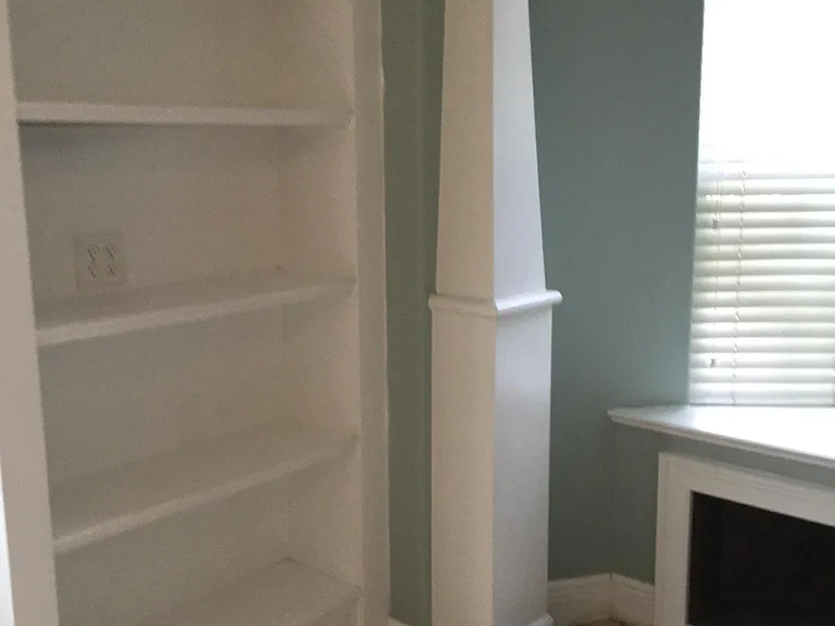 Custom built in bookshelf in den.