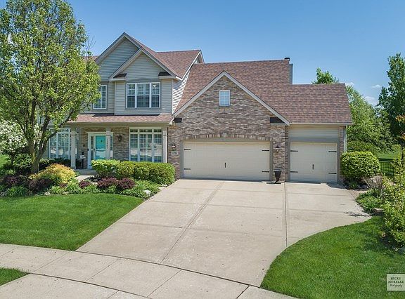 THREE CAR GARAGE, LONG CONCRETE DRIVEWAY, NEWER ROOF IN 2010.