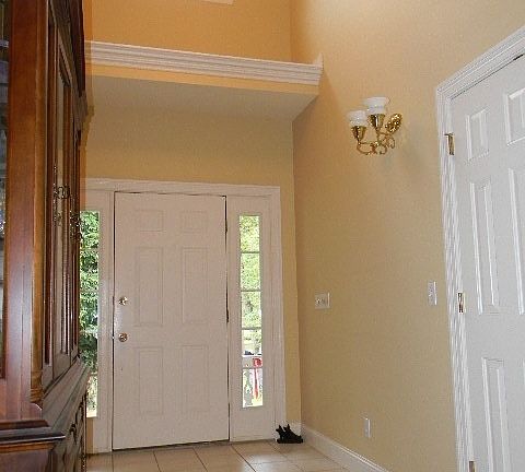 With tiled floor and off to the side is private den or office space