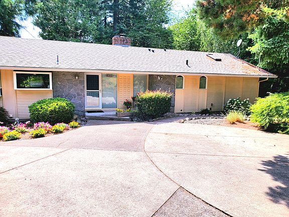 Two car drive way in front with private side entrance.