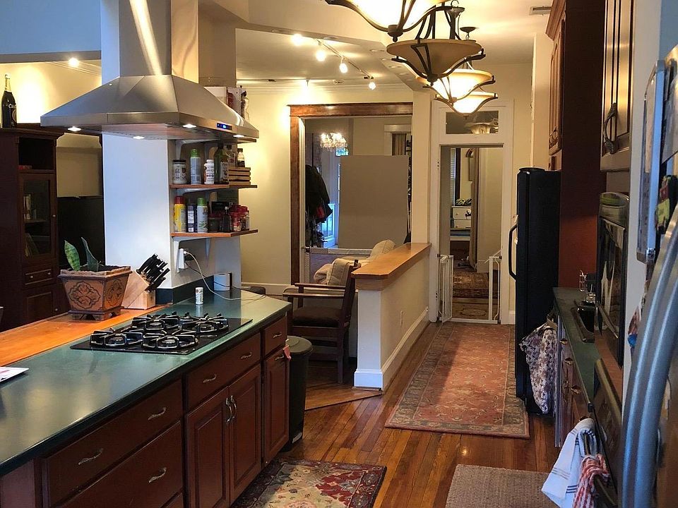 View towards the front door from end of the kitchen. The dining area is right behind me.