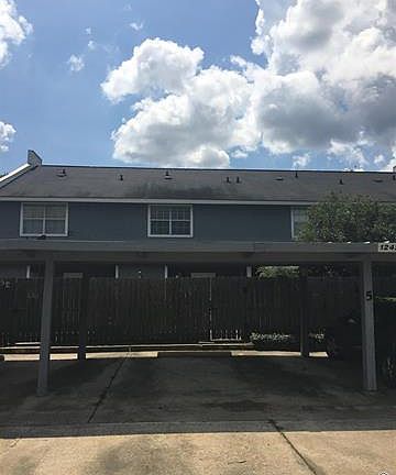Two car storage with gated entry to courtyard and house.