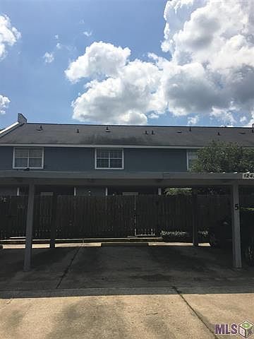 Two car storage with gated entry to courtyard and house.