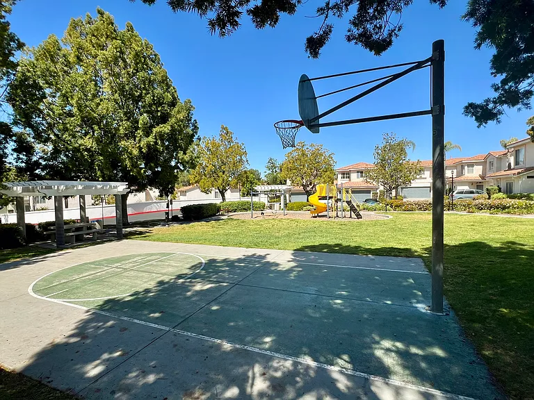 Basketball court by park, right in front of the house