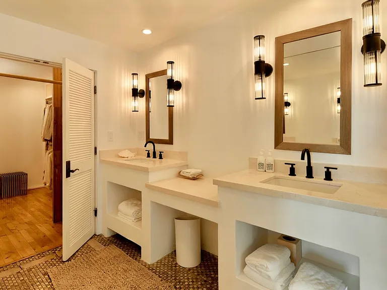 Luxurious primary bathroom with walk in shower and bath tub
