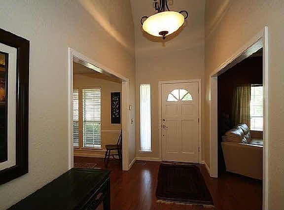 Welcoming Entry with Beautifully refinished hardwood floors