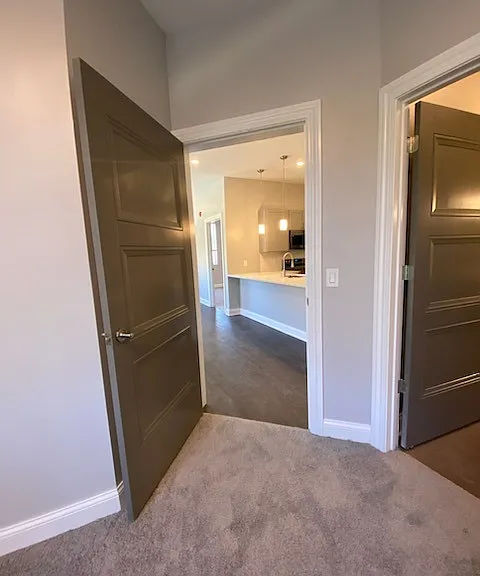 Bedroom One View to Living Room and Kitchen Bedroom One View to Living Room and Kitchen