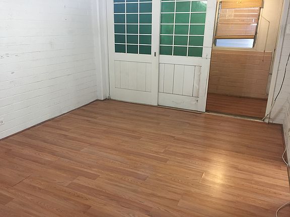 Bedroom with doors to enclosed lanai