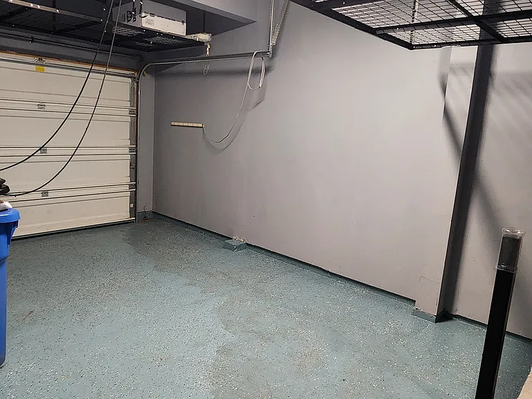 1 car garage with bike rack and 2 large overhead storage racks
