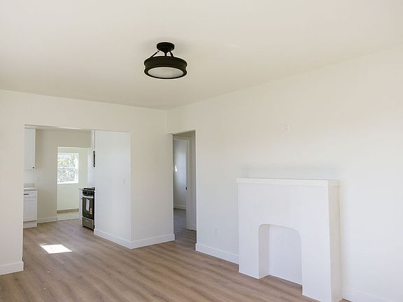 Living Room facing kitchen and bedrooms