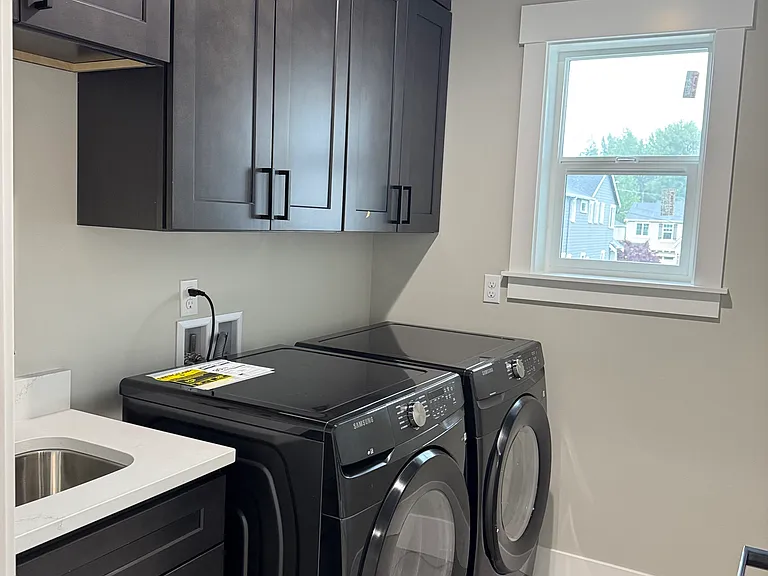 Laundry with front loading washer/dryer