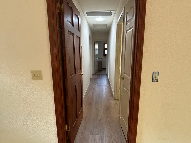 Privacy Hallway to the 3 bedrooms and 2 baths