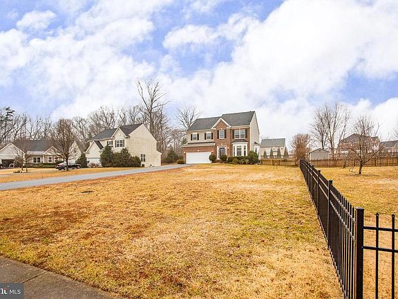 Large front yard with in-ground sprinkler system!