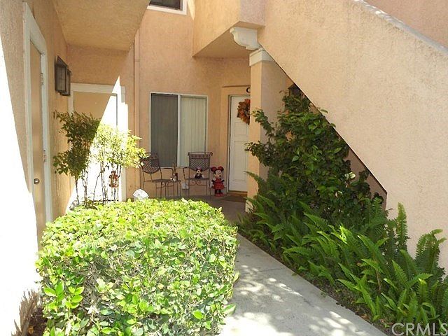 Downstairs unit. Entry door to the right and garage access door to the left.