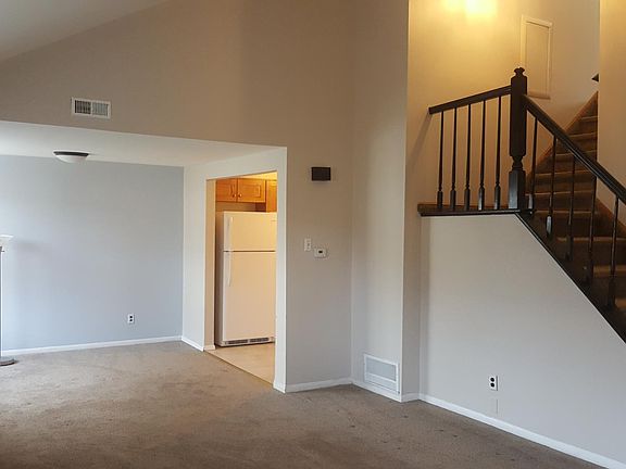 Kitchen and dining area to the left.
