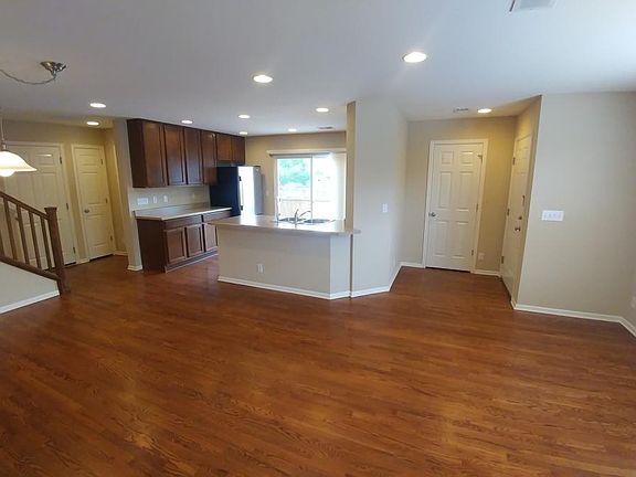 Open living with wood floors