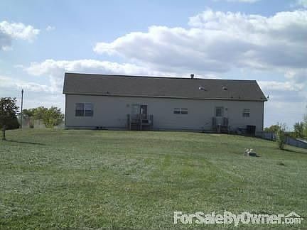 Back of the house
						:
						Two doors out the back with small porches at each exit