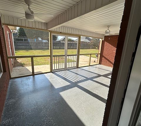 Covered Screened in Patio with epoxy finished flooring to include new ceiling fans