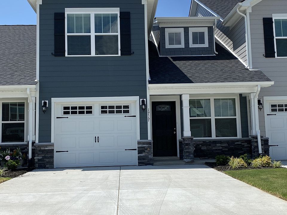 Craftsman style three bedroom, three bath, one car garage, master upstairs, fenced in patio and mor