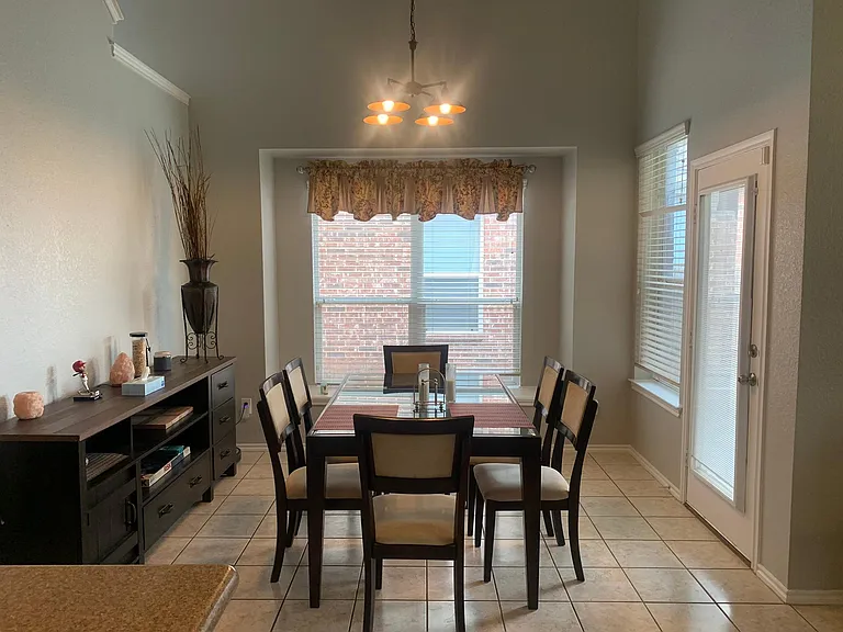 Dining area to enjoy meals with back entry to covered patio.