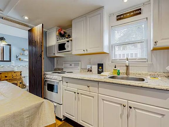 Full kitchen with Oven, micro, large counter and sink area, lots or storage